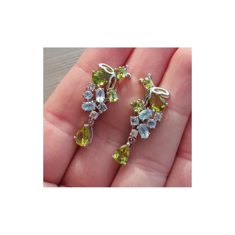 Silver earrings set with peridot, blue topaz and chalcedone