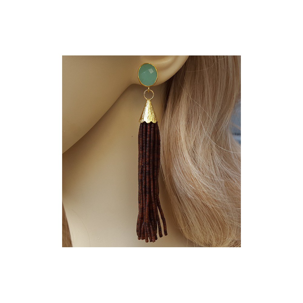 Gold gilded long earrings of brown beads and chalcedone