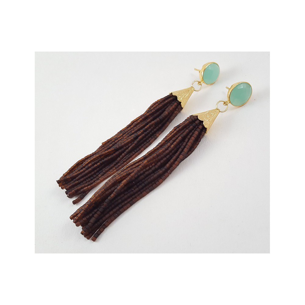 Gold gilded long earrings of brown beads and chalcedone