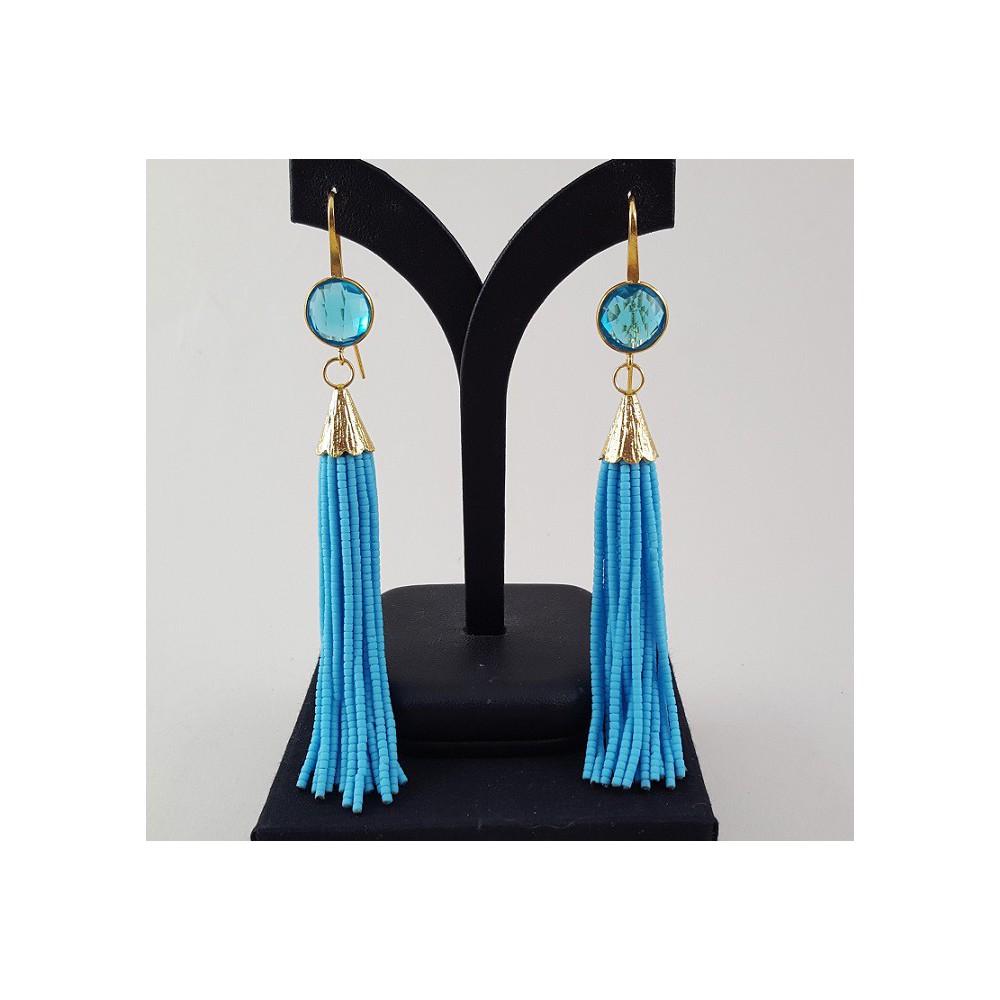 Gold Gilded long earrings of turquoise blue beads and topaz