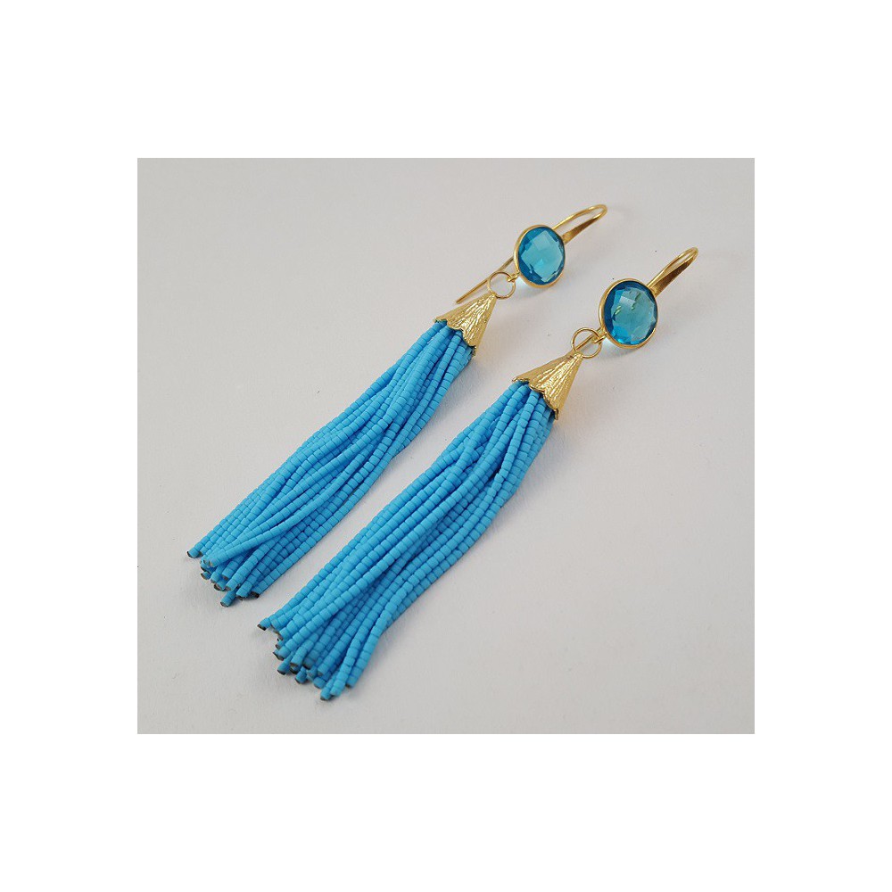 Gold Gilded long earrings of turquoise blue beads and topaz