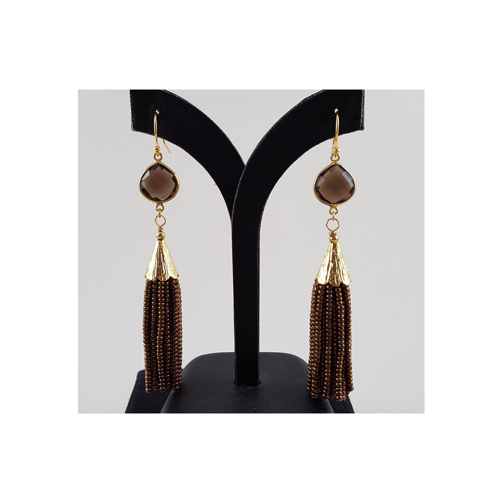 Gilded earrings with smokey topaz and pendant of brown beads