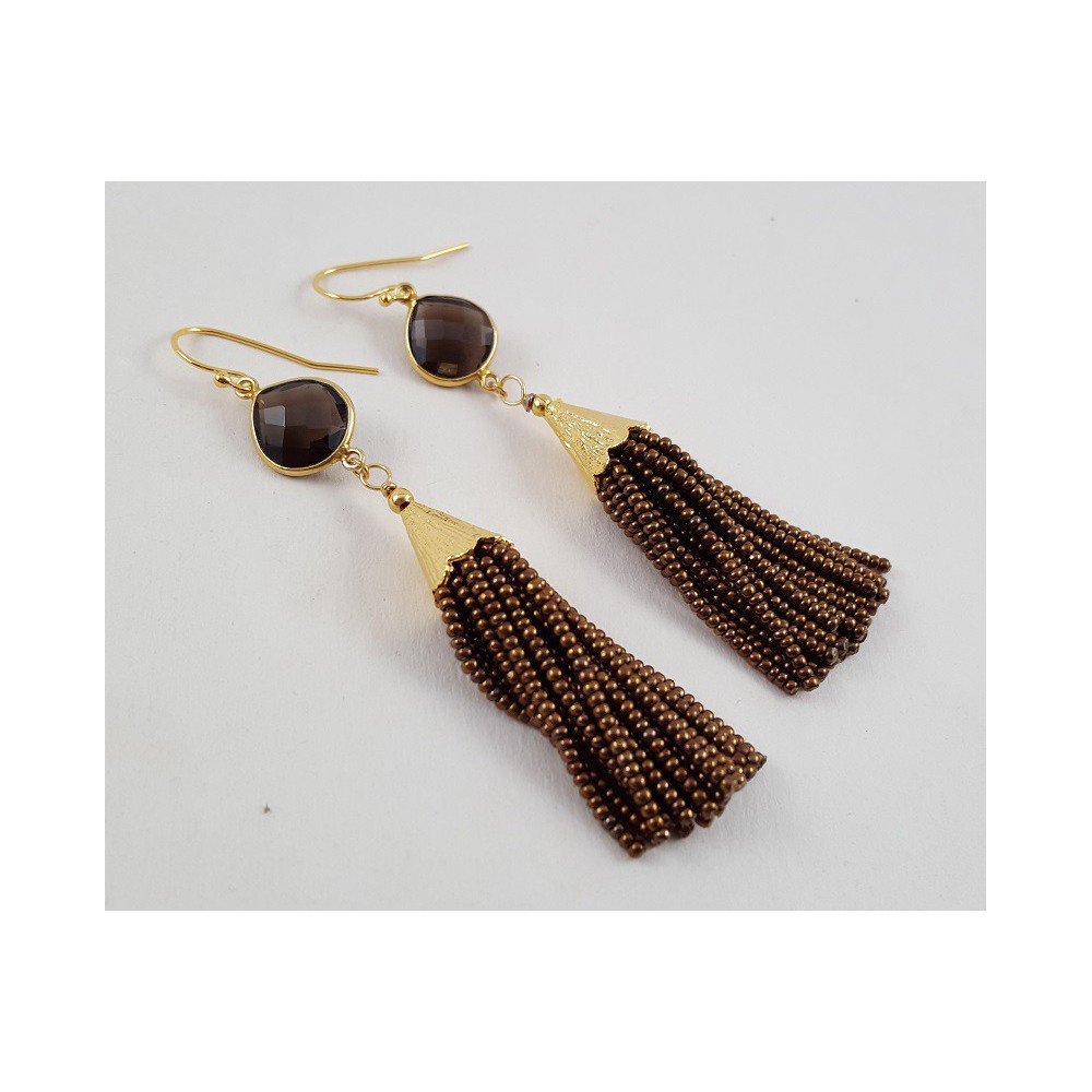 Gilded earrings with smokey topaz and pendant of brown beads