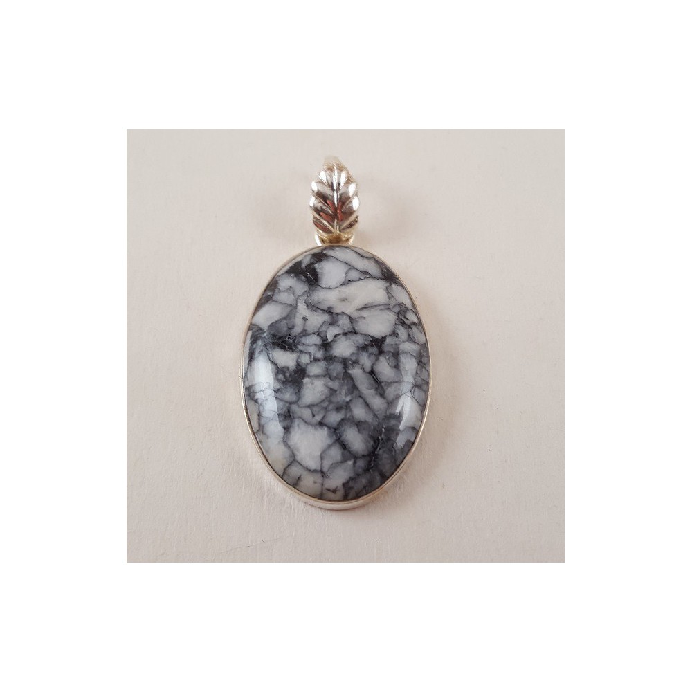 Silver pendant set with oval pinolite