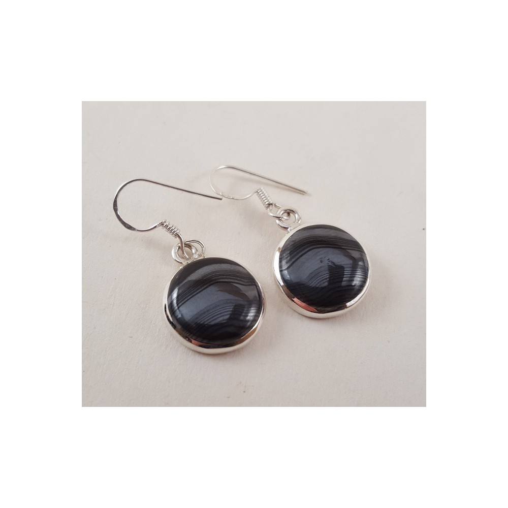 Silver earrings set with round psilomelaan