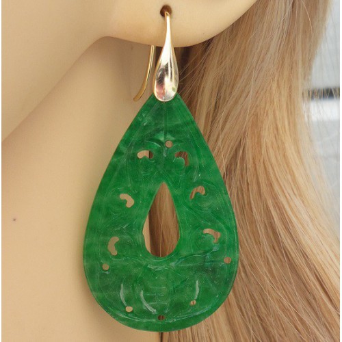 Gilded earrings set with carved green jade