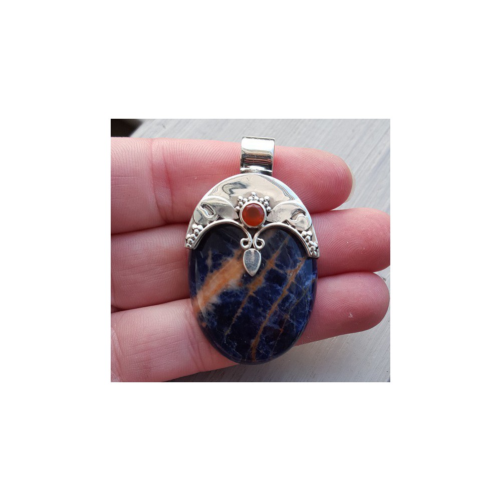 Silver pendant set with oval sodalite and carneool