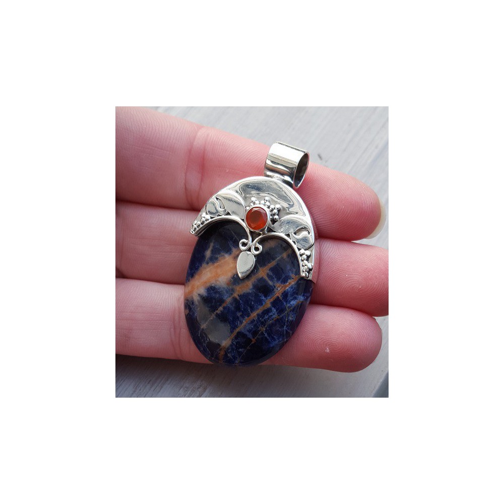 Silver pendant set with oval sodalite and carneool