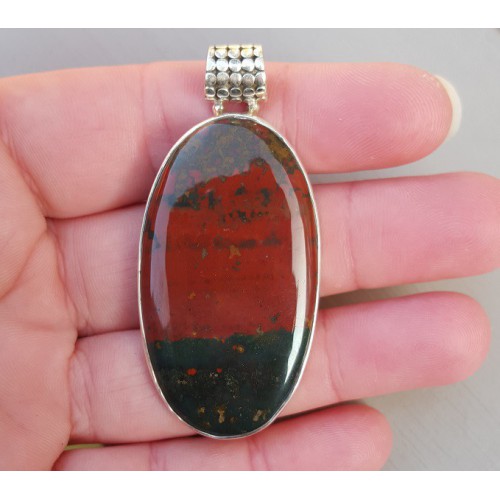 Silver pendant set with large oval cabochon bloodstone