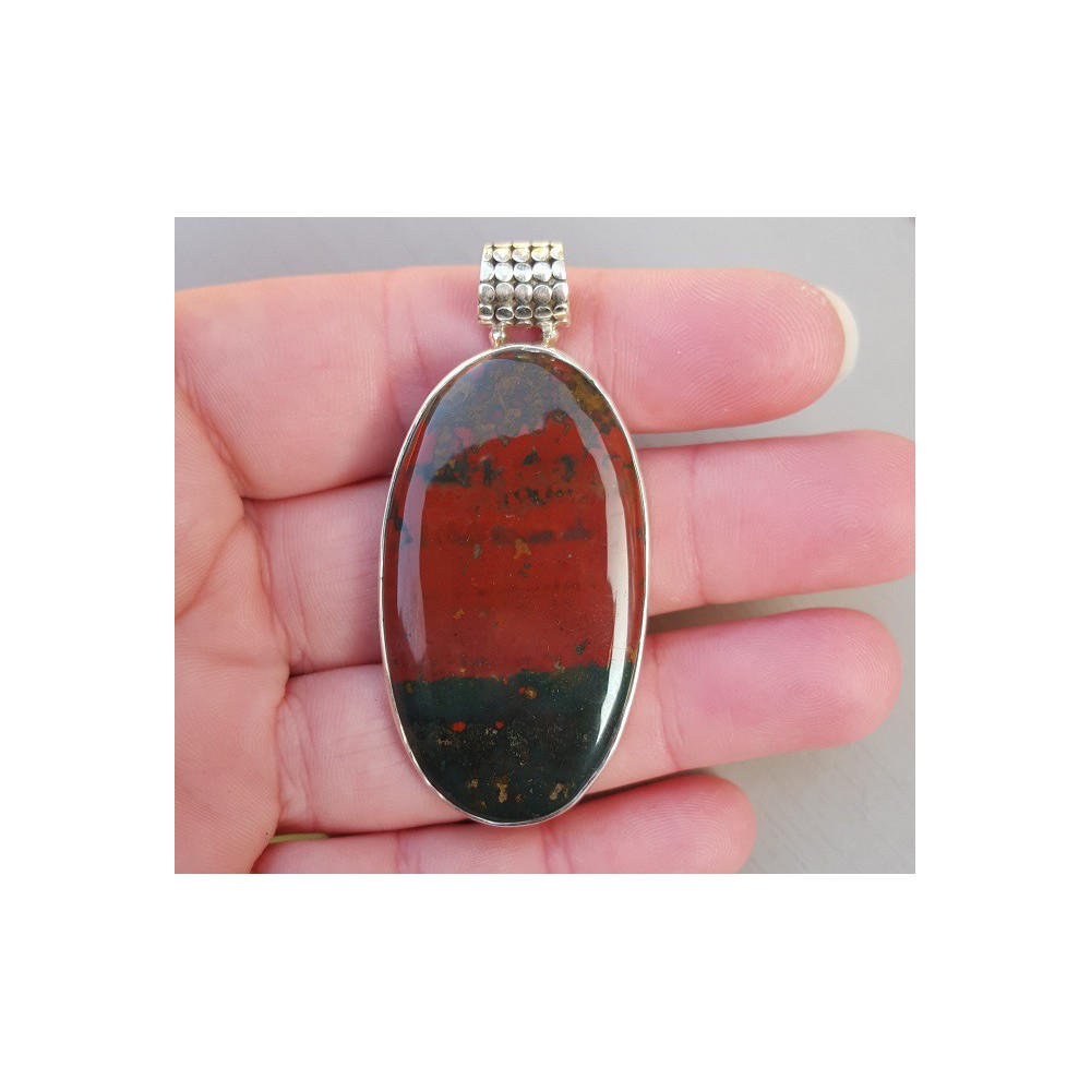 Silver pendant set with large oval cabochon bloodstone