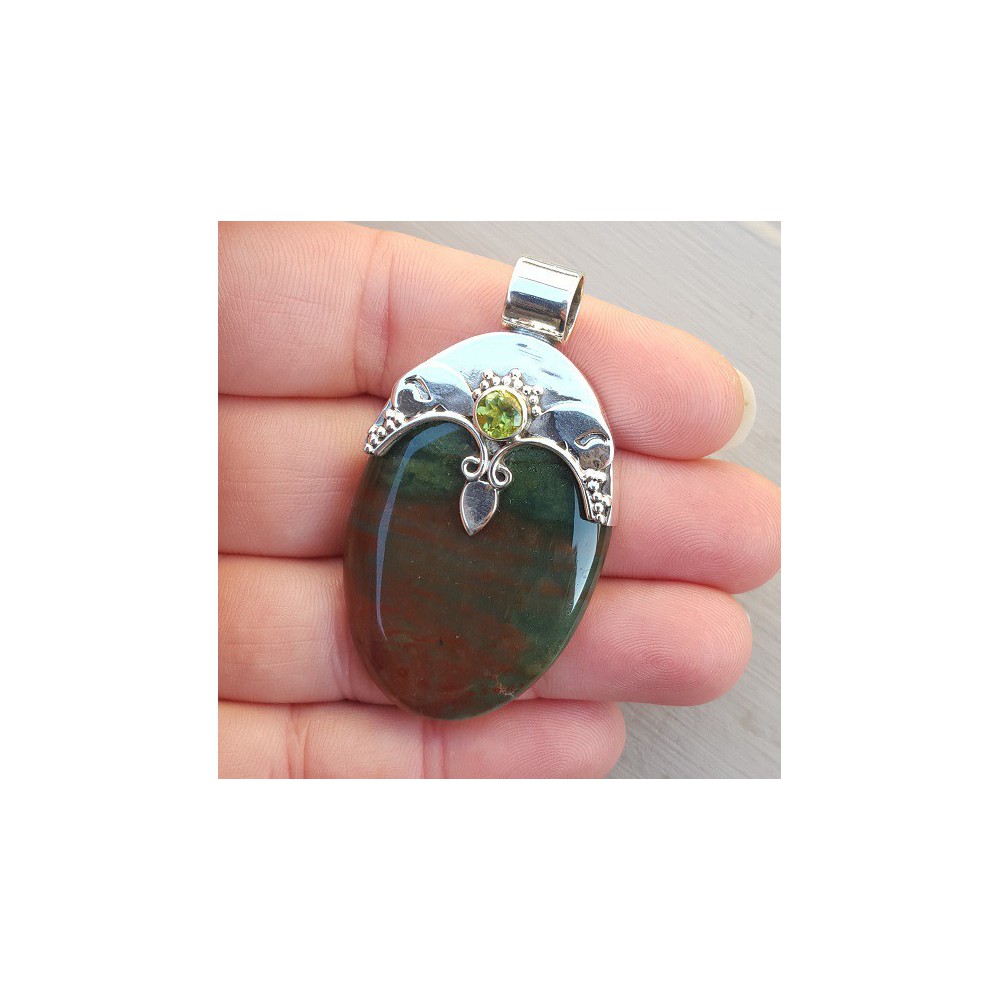 Silver pendant set with round peridot and bloodstone