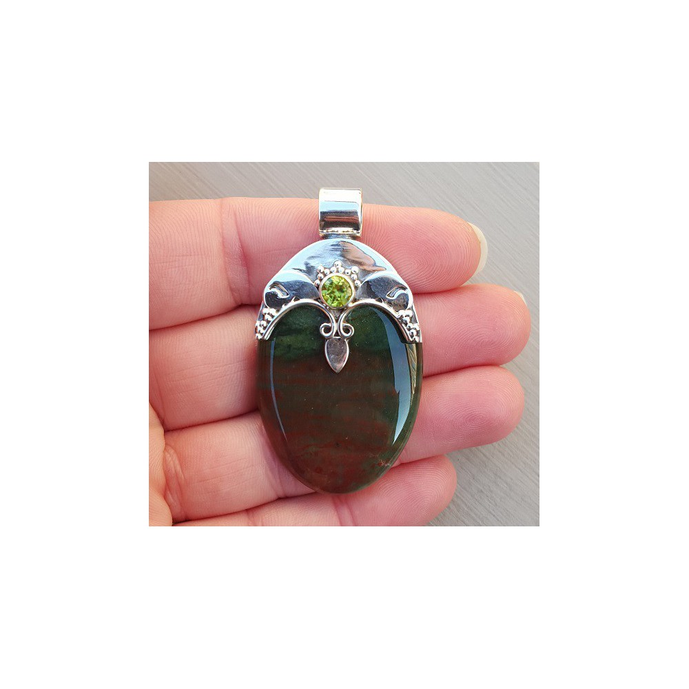 Silver pendant set with round peridot and bloodstone