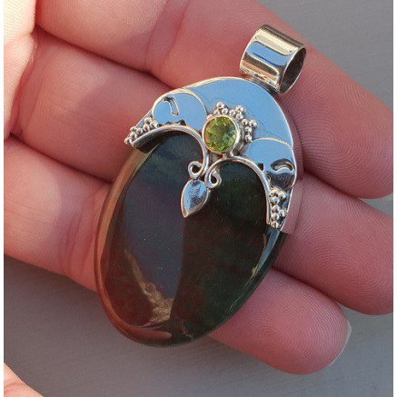 Silver pendant set with round peridot and bloodstone