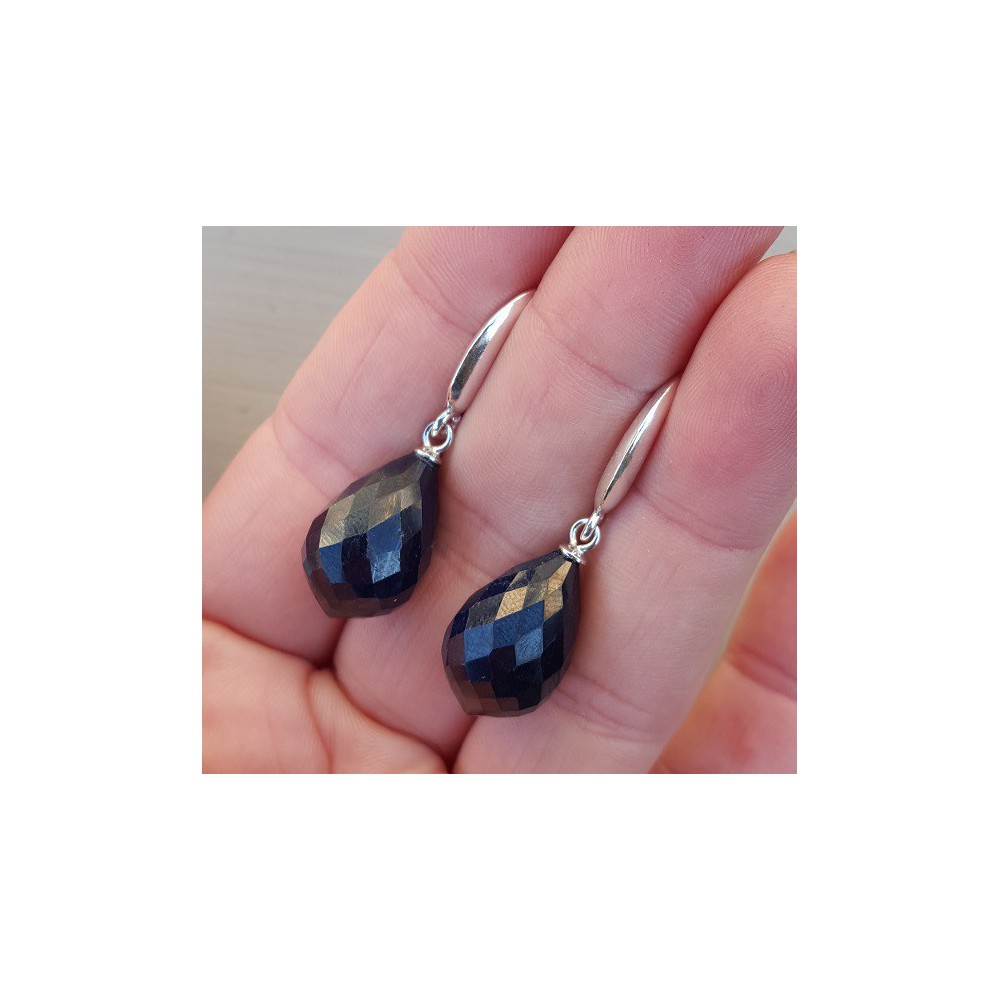 Silver earrings with large dark blue sapphire briolet