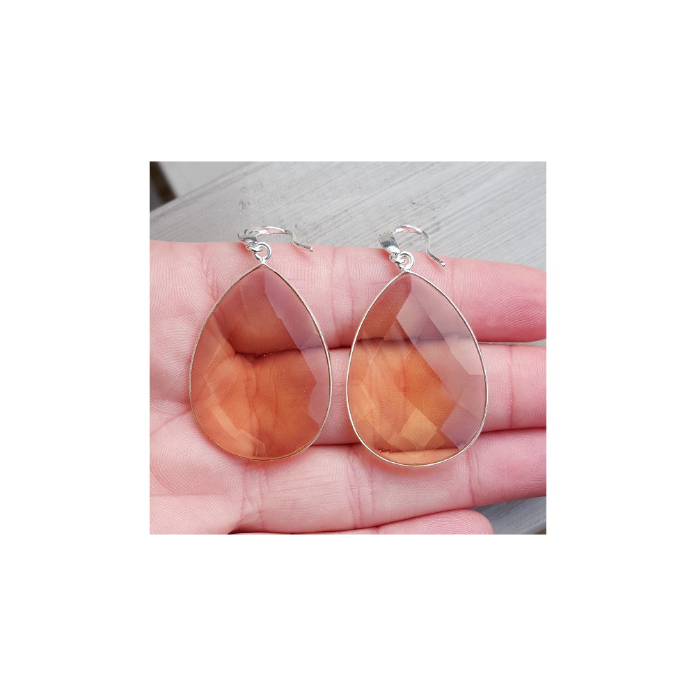 Silver earrings set with large honey topaz