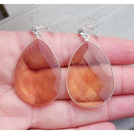 Silver earrings set with large honey topaz