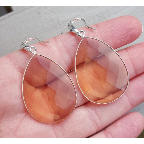 Silver earrings set with large honey topaz