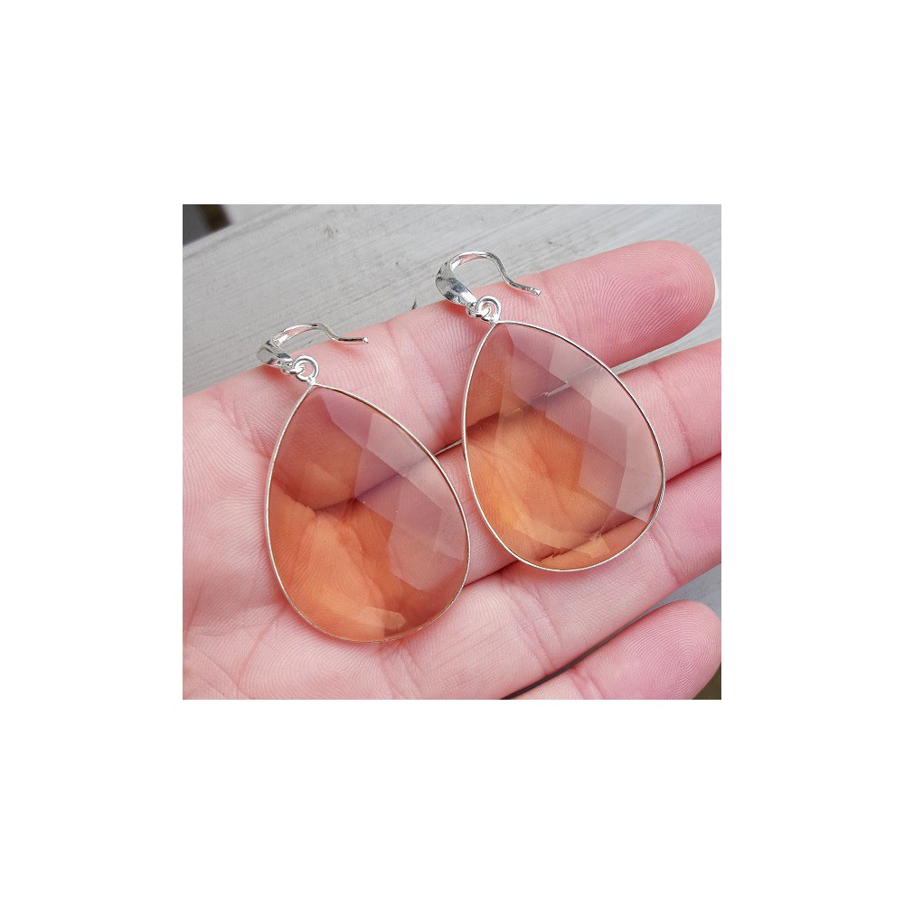 Silver earrings set with large honey topaz