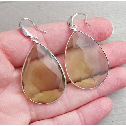 Silver earrings set with large green amethist quartz