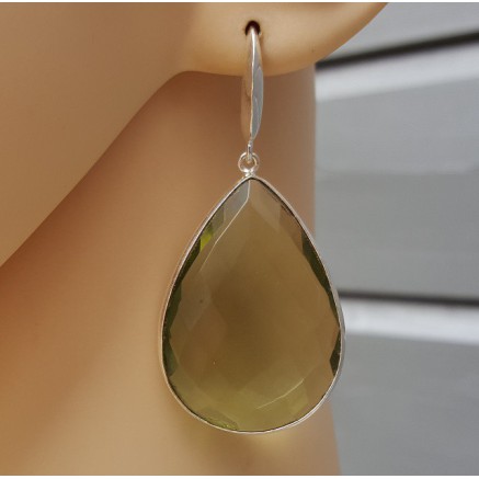 Silver earrings set with large green amethist quartz