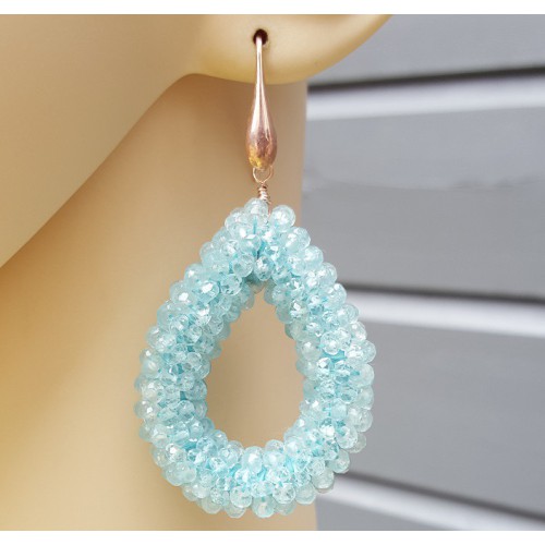 Earrings with an open drop of aquamarine