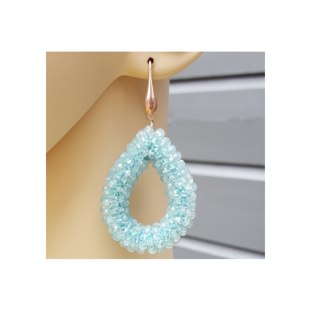 Earrings with an open drop of aquamarine