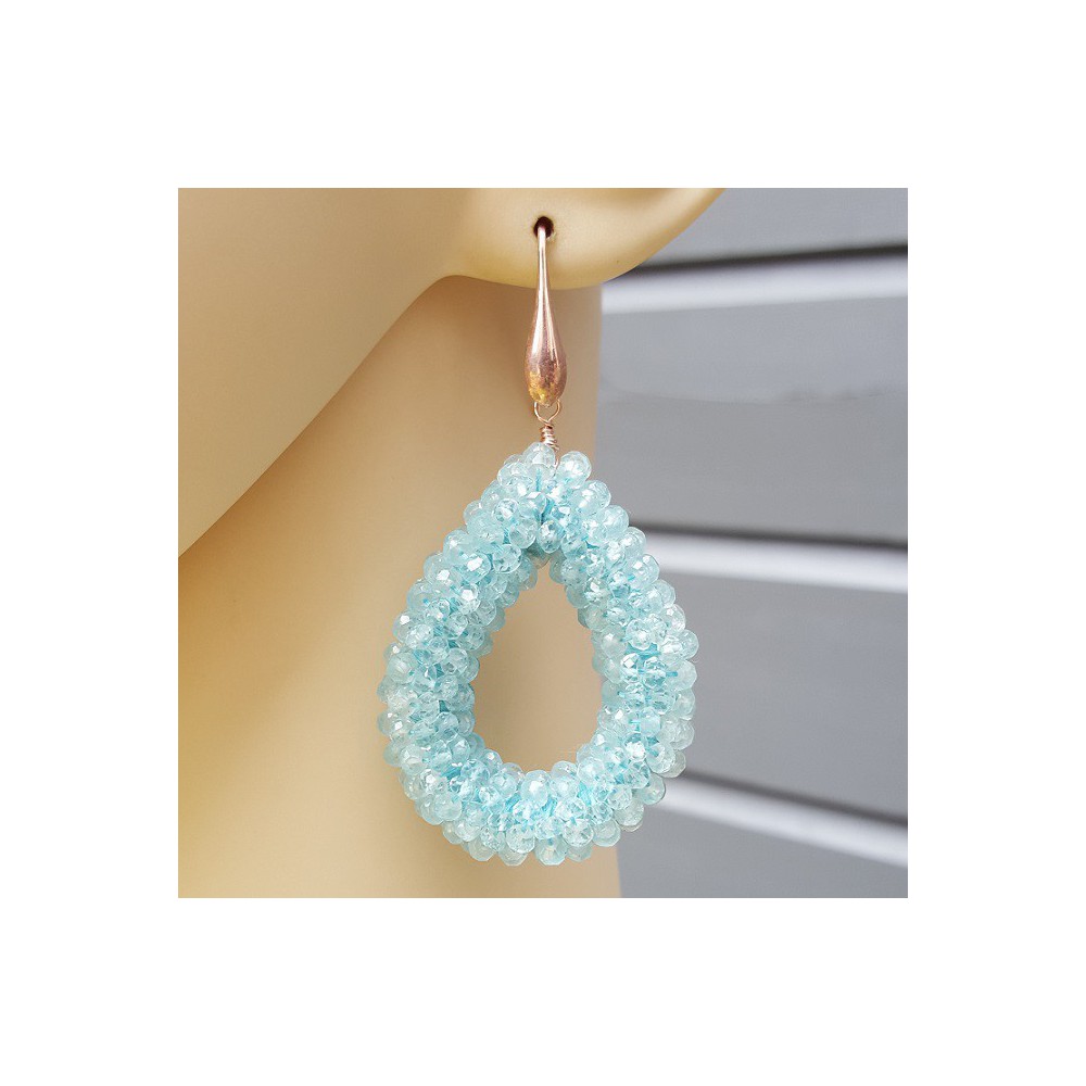 Earrings with an open drop of aquamarine