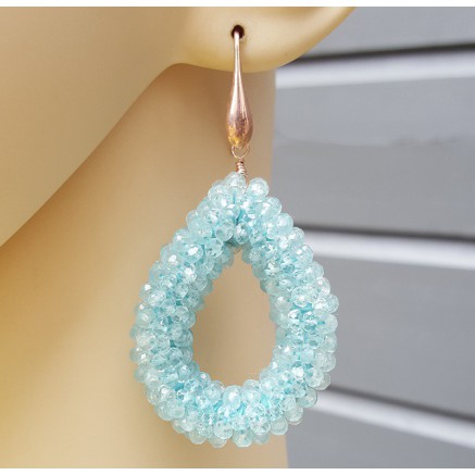 Earrings with an open drop of aquamarine