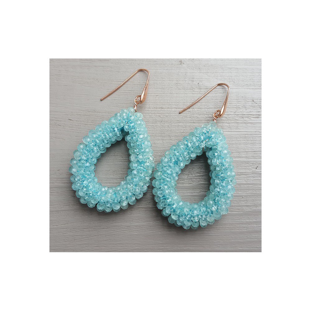 Earrings with an open drop of aquamarine