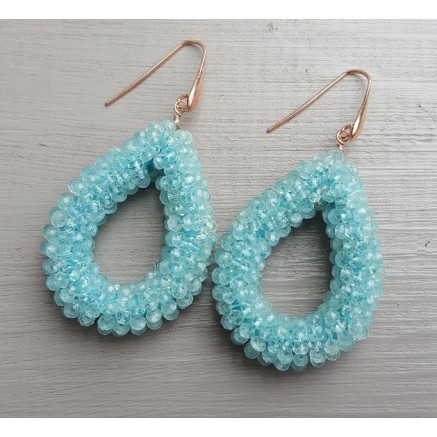 Earrings with an open drop of aquamarine