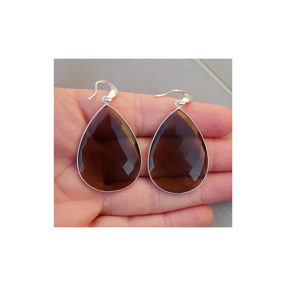 Silver earrings set with large smokey topaz