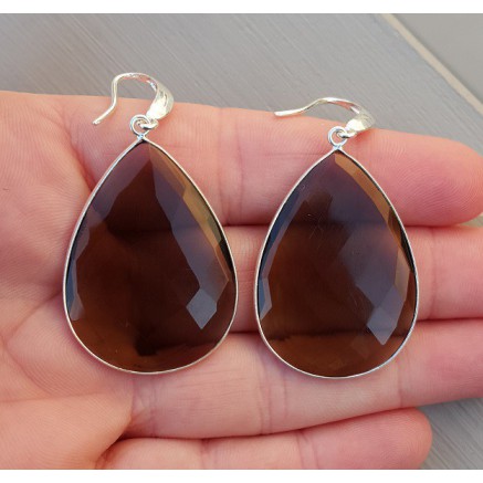 Silver earrings set with large smokey topaz