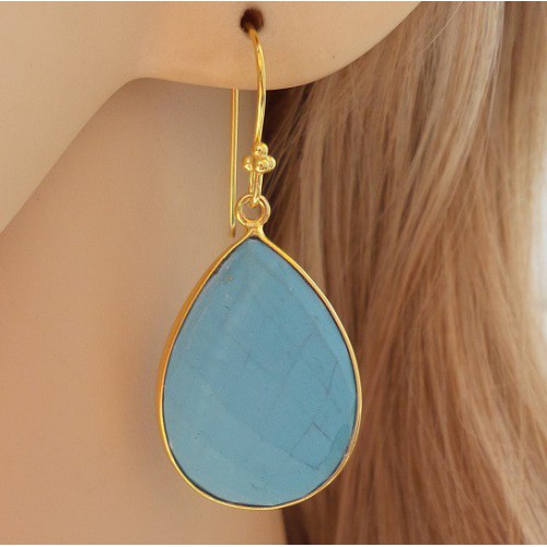 Gilded earrings set with drop -shaped turquoise