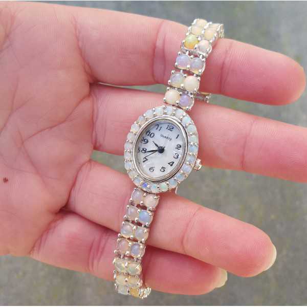 Silver watch set with round cabochon Ethiopian Opals