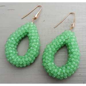 Earrings with open drop of apple green crystals